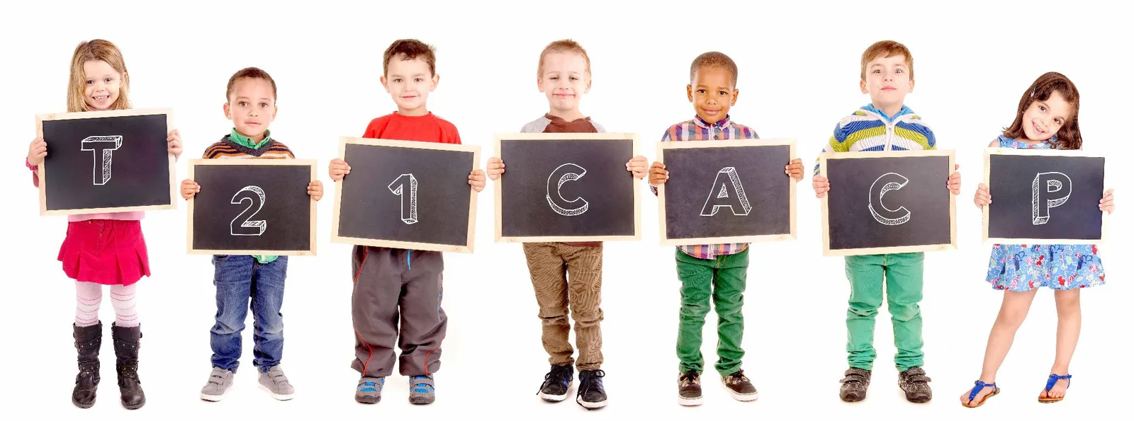 Seven schoolchildren each holding a small chalkboard, together spelling T21CACP